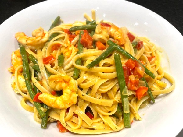 Scampi met boontjes, paprika en pasta